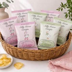 May include: A collection of Silly Goose Crisps snack bags in a woven basket. The bags feature a goose illustration, vertical stripes, and personalized text such as Made Especially for Peggy or Oliver. A small bowl of potato chips sits nearby.