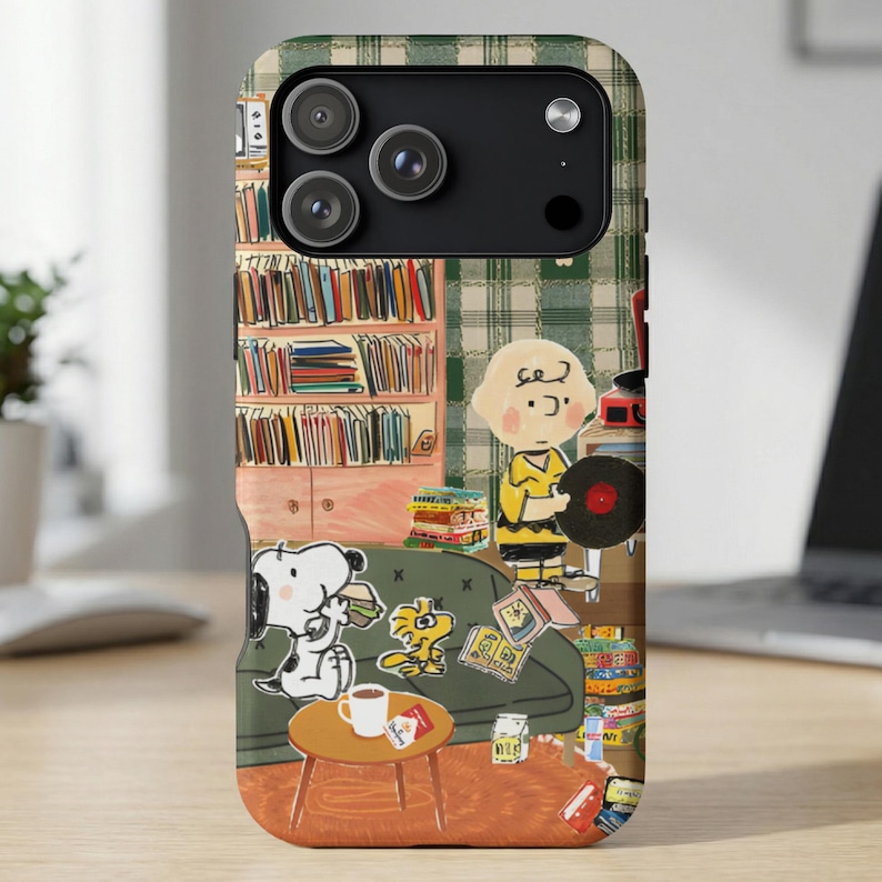 Peanuts characters Snoopy and Woodstock on a phone case with a bookshelf and record player.
