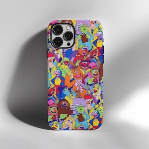 May include: A brightly coloured phone case with a collage of Muppet characters. The case features a variety of well-loved characters in a playful design, ideal for fans of the classic show. The case has a glossy finish.