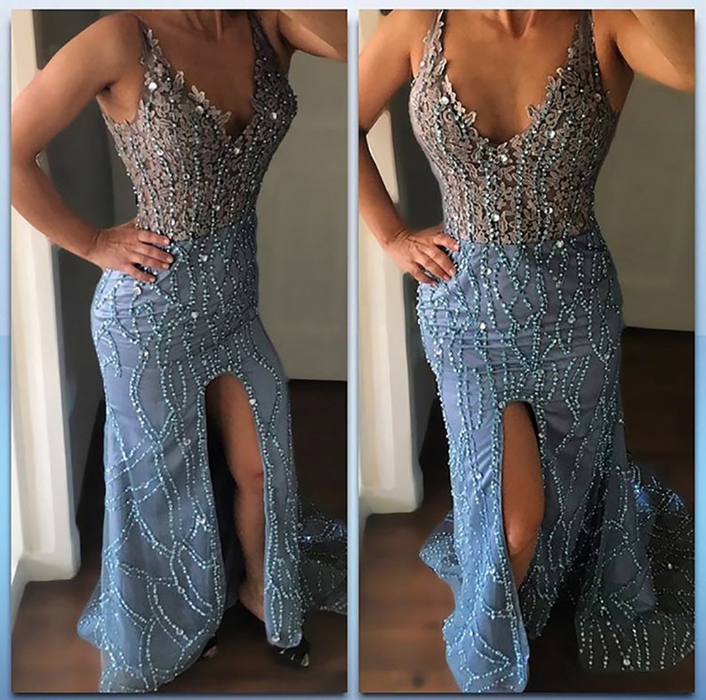Model wearing a custom-made light blue evening gown with a beaded bodice, deep V-neckline, and intricate beadwork on a fitted skirt featuring a thigh-high slit
