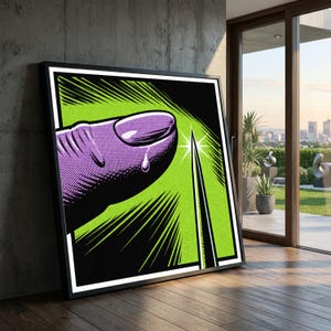 Op de afbeelding: Ingelijste pop-art print met een paarse vinger doorboord door een naald. De achtergrond is felgroen met zwarte lijnen. Het kunstwerk is zwart omlijst met een witte rand.