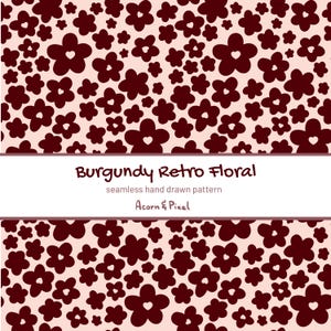 Peut inclure: Un motif sans couture de fleurs bordeaux avec des cœurs sur un fond rose clair. Le texte "Burgundy Retro Floral" est affiché au-dessus du motif, avec "seamless hand drawn pattern" et "Acorn & Pixel" en dessous.