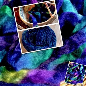 May include: Close-up of colorful fiber art in shades of blue, green, and purple. The image features a basket of fiber, a skein of yarn, and loose fibers, all showcasing the vibrant colors and textures of the material. The fiber appears soft and fluffy.