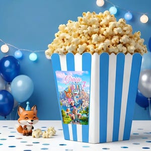 May include: A white ceramic mug with a black handle and the text "But First, Coffee" in a black, handwritten-style font. The mug is on a white surface.