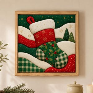 May include: A square framed wall art piece featuring a central Christmas stocking design. The stocking is decorated with red, green, and white patterns, including holly leaves, berries, and plaid. The background shows snowy hills and stars.