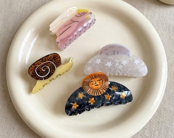 Pinzas para el pelo de plástico hechas a mano, con forma de caracol, ángel, sol y luna, para mujeres y niñas.