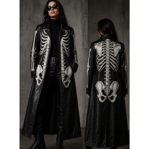 May include: Black faux leather coat featuring a white skeleton design on the front and back. The long coat has a classic collar, a belt, and a knee-length hemline. The skeleton design includes the rib cage, pelvis, and arm bones.