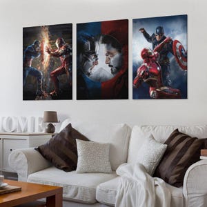 May include: A triptych of canvas prints showcasing Captain America and Iron Man in action. The artwork uses vivid colours and detailed imagery to depict the characters in dynamic poses. Ideal for a superhero-themed room, the prints are a great addition.