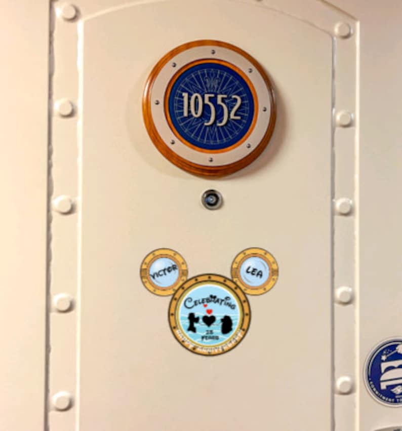 This is an anniversary magnet for disney lovers! It is a silhouette of disney characters and one name in each ear and the words happy anniversary at the bottom.