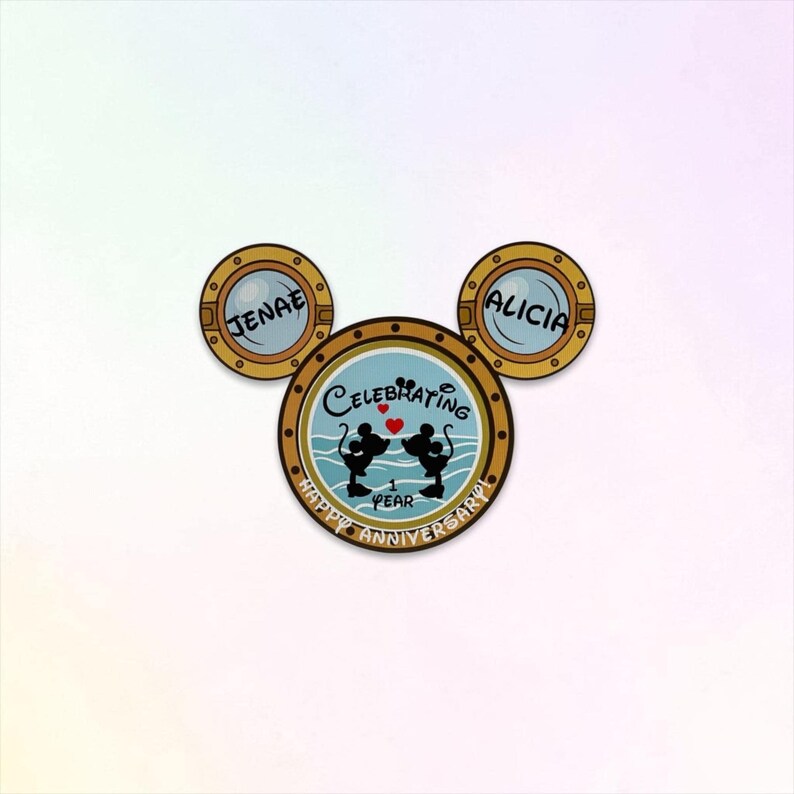 A Mickey Mouse head-shaped magnet, with two porthole ears labeled "JENAE" and "ALICIA," and the main porthole showing Mickey and Minnie Mouse silhouettes, text "CELEBRATING 1 YEAR," and "HAPPY ANNIVERSARY" below.
