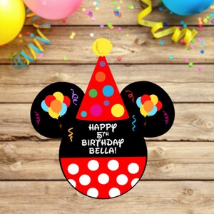 May include: A black and red birthday sign shaped like a mouse head with a party hat. The hat is red with colorful polka dots and a yellow pom-pom. The black ears feature balloon graphics. Text reads: HAPPY 5TH BIRTHDAY BELLA! with white polka dots below.
