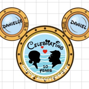 A Mickey Mouse head-shaped magnet, with two porthole ears labeled "DANIELLE" and "DANIEL," and the main porthole showing a couple's silhouettes, text "CELEBRATING 10 YEARS," and "HAPPY ANNIVERSARY" below.