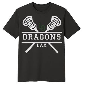 May include: Dark gray t-shirt featuring a white lacrosse stick design with the text "DRAGONS LAX". The design includes two lacrosse sticks and the team name. A green logo is above the text.