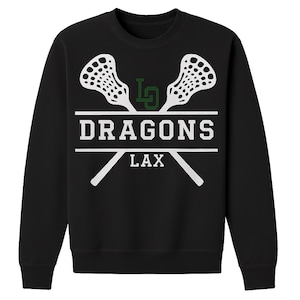 May include: Black sweatshirt with a white and green lacrosse design. The design includes two crossed lacrosse sticks, the word "DRAGONS" in a bold font, and the word "LAX" below. The sweatshirt also features the letters "LD" in green.