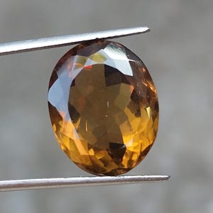 brown quartz gemstone
oval cut quartz
faceted brown quartz
natural quartz stone
loose gemstone
jewelry making stone
luxury quartz gem
oval brown gemstone
quartz ring stone
pendant gemstone
gemstone gift for her