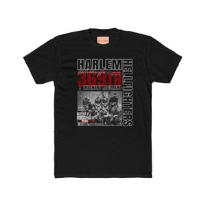 May include: A black short-sleeve t-shirt featuring a graphic print with the text HARLEM HELLFIGHTERS and 369TH INFANTRY REGIMENT. The design includes a black and white historical photograph of soldiers, along with the words FRANCE, NEW YORK, and GOD DAMN.