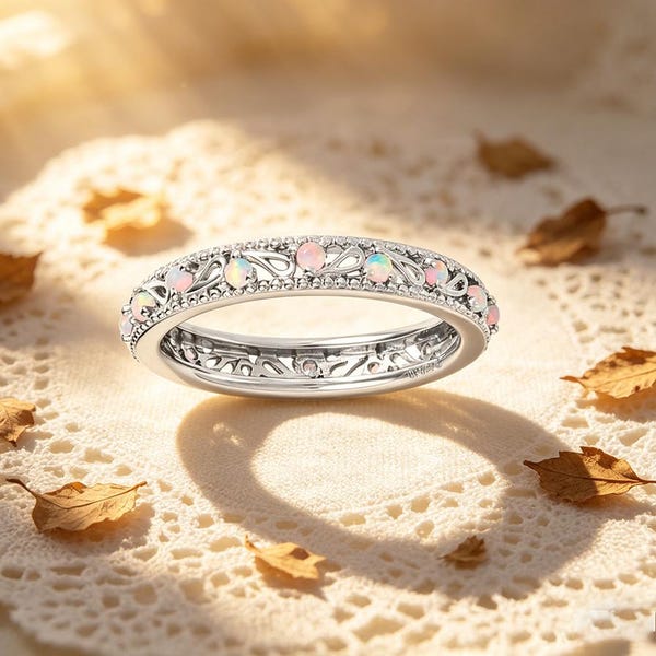 opal eternity band ring with filigree design silver tone