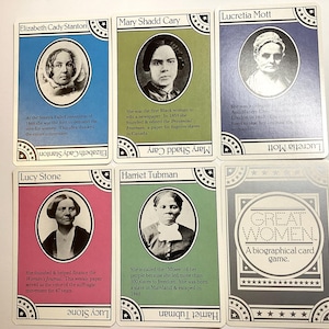 May include: A set of six biographical trading cards featuring portraits of notable women. The cards have colored backgrounds and include the names Elizabeth Cady Stanton, Mary Shadd Cary, Lucretia Mott, Lucy Stone, and Harriet Tubman. The back of the cards reads "Great Women".