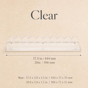 May include: A clear, scalloped-edge shelf. The shelf is 17.5 inches (444 mm) long and 2.8 inches (71 mm) wide. The text "Clear" is above the shelf. The shelf is 1.3 inches (33 mm) tall.