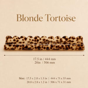 May include: A decorative Blonde Tortoise hair clip with a scalloped edge. The clip is 17.5 inches long and 2.8 inches wide. The text "Blonde Tortoise" is at the top of the image.