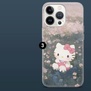 May include: Clear phone case featuring a Hello Kitty design. The case has a painted floral background with a light pink and green color scheme. Hello Kitty is wearing a pink bow and dress.