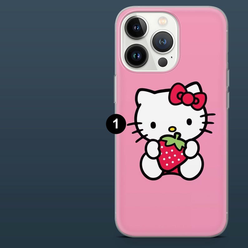 May include: Pink phone case featuring a Hello Kitty design. The white cartoon cat has a red bow and is holding a strawberry. The case has a clear border and covers the phone's camera and buttons.