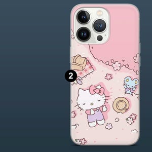 May include: Pink phone case featuring a cartoon picnic scene with Hello Kitty, a mouse, flowers, and a picnic basket. The case has a clear border and a glossy finish.