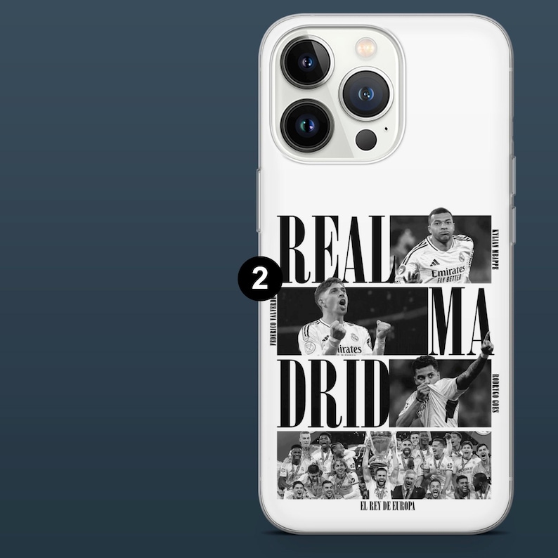 May include: White phone case featuring a black and white design with the words "REAL MADRID" and images of soccer players. The case also includes the text "EL REY DE EUROPA".
