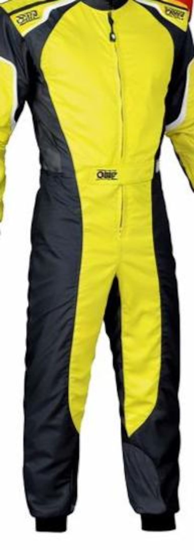 May include: A bright yellow and black racing suit featuring a high collar, a central zipper closure, and long sleeves. The garment displays the OMP brand logo on the chest and shoulders, with white accent piping along the upper torso and arms.
