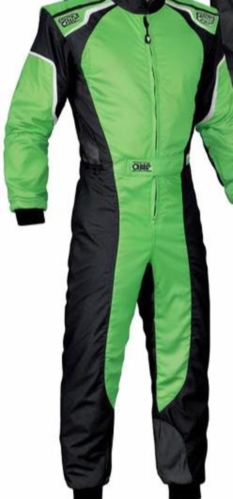 May include: A bright green and black racing suit featuring a high collar, a full-length front zipper, and long sleeves with black cuffs. The garment includes white piping accents along the shoulders and the OMP logo on the chest and waist belt.