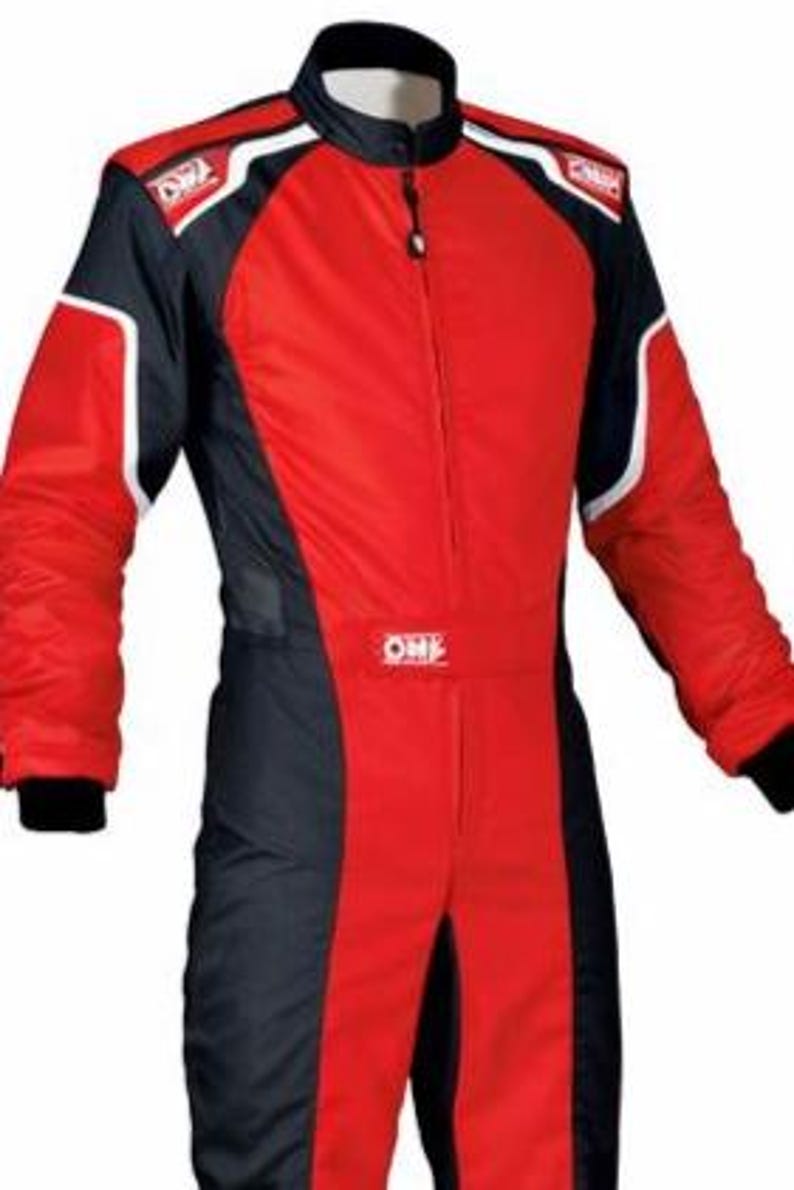 May include: A red and black racing suit featuring a high collar, a central zipper closure, and long sleeves with black cuffs. The garment displays the OMP logo on the chest and shoulders, with white piping accents along the shoulders and arms.