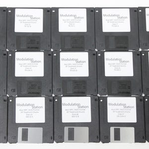 May include: A set of three ceramic nesting bowls in shades of blue, green, and white. The bowls feature a speckled glaze and a simple, modern design. The largest bowl measures approximately 6 inches in diameter.