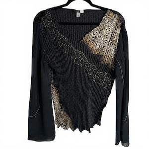 May include: A set of three ceramic mugs with a speckled, matte finish. The mugs are in shades of cream, light gray, and dark gray. Each mug has a simple, minimalist design, perfect for coffee or tea.