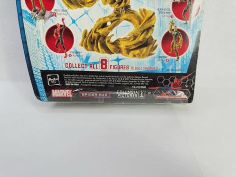 May include: A Marvel Spider-Man action figure package. The packaging is blue and white with images of Spider-Man and other characters. The text "COLLECT ALL 8 FIGURES" is visible. The Marvel and Spider-Man logos are also present.