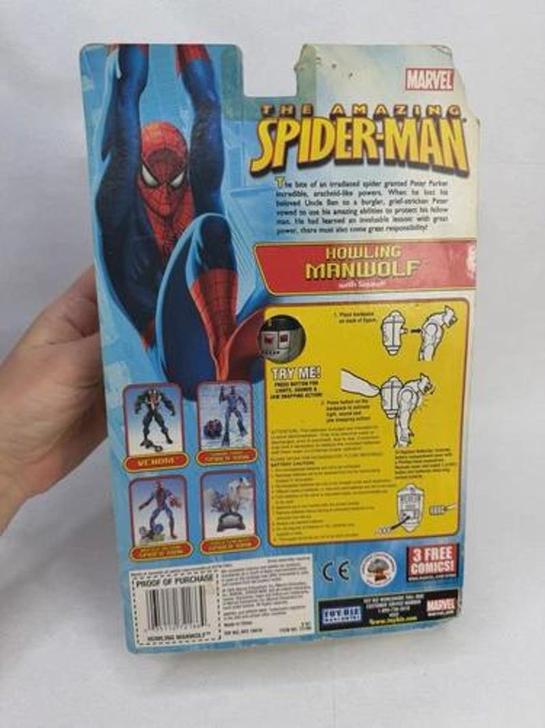 May include: The Amazing Spider-Man action figure packaging. The package features a large image of Spider-Man in a blue and red suit. The text "HOWLING MANWOLF" is visible, along with the Marvel logo.
