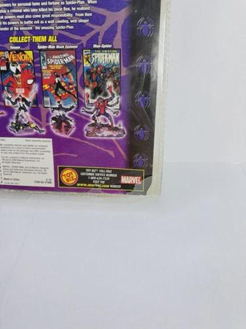 May include: A packaged Marvel Spider-Man action figure set. The packaging features comic book covers of Spider-Man characters, including Venom and Man-Spider. The text "COLLECT THEM ALL" is visible.