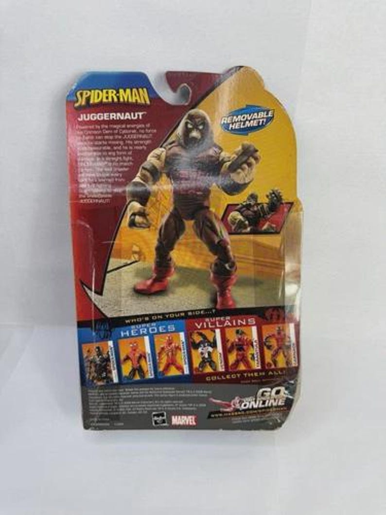 May include: A Spider-Man Juggernaut action figure in its original packaging. The figure is brown and tan with red boots. The packaging features the text "REMOVABLE HELMET!" and "COLLECT THEM ALL!"
