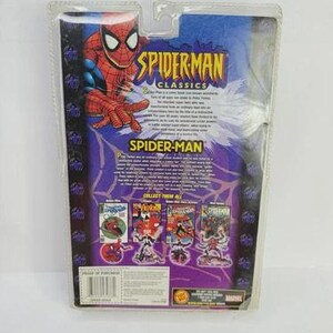 May include: A Spider-Man Classics action figure in its original packaging. The packaging features a vibrant image of Spider-Man, with the words "Spider-Man Classics" and "Spider-Man" prominently displayed. The back of the package showcases comic book covers.