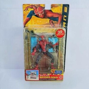 May include: Spider-Man action figure in packaging. The figure is red and black, with a detailed costume. The packaging features a Spider-Man graphic and the text "Spider-Man with Subway Accessory". The packaging also states "39 Points of Articulation".