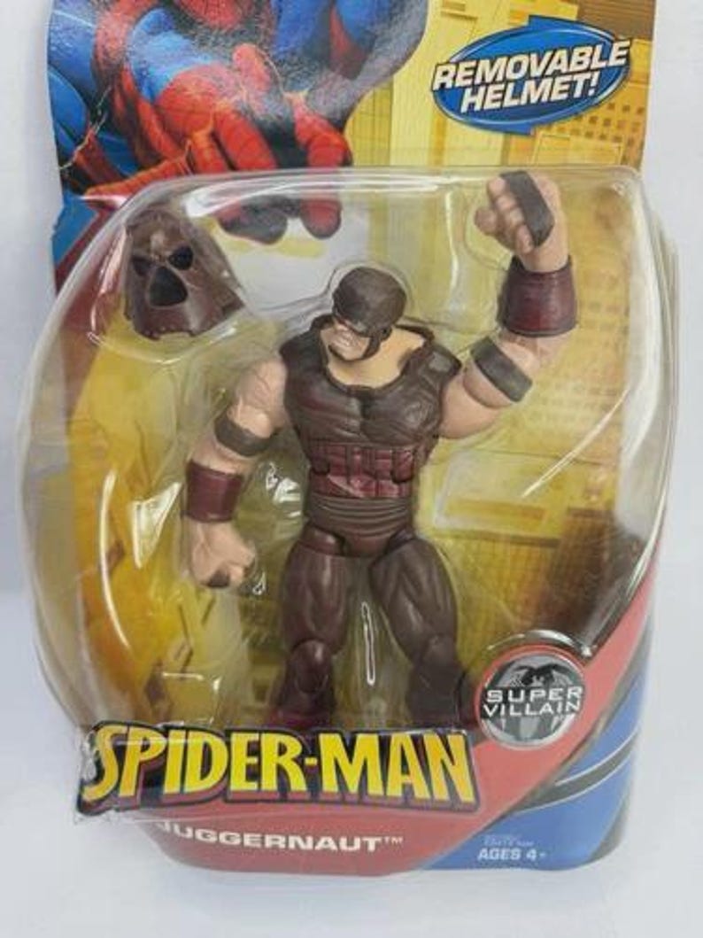May include: Juggernaut action figure from the Spider-Man series, packaged in a clear plastic blister pack. The figure is mostly brown with red accents and a removable helmet. The packaging features the Spider-Man logo and the words "Super Villain."