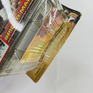 May include: Sealed Spider-Man toy package. The packaging features the words "SLIDE SPIDER-MAN PROJECTILE LAUNCHER" and "SHOOT SPIDER WITH MAGN". The package has a red, yellow, and black color scheme, with images of Spider-Man.