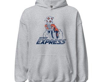 Könnte beinhalten: Hellgrauer Kapuzenpullover mit einer Grafik eines Cartoon-Autos und einem Fußball darüber. Das Auto ist orange und blau, mit dem Text "DETROIT EXPRESS" in Blau auf der Vorderseite.