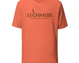 May include: Orange short-sleeve t-shirt with the word "LECHMERE" in brown, along with a small graphic and the text "WHERE YOU POCKET THE DIFFERENCE." The shirt is made of a soft material.