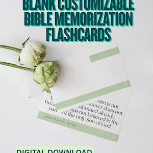 May include: White flashcards with green accents and text that reads "BLANK CUSTOMIZABLE BIBLE MEMORIZATION FLASHCARDS" and "DIGITAL DOWNLOAD". The flashcards have Bible verses printed on them. Two white flowers are in the upper left corner.