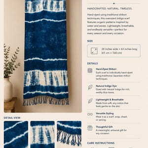 May include: An oversized indigo scarf featuring white shibori patterns, measuring 24 inches wide by 63 inches long. The scarf has a deep blue color with horizontal tie-dye stripes and a fringed bottom edge, displayed hanging from a wooden rod.