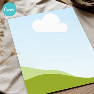 May include: A rectangular sheet of paper featuring a graphic illustration of a light blue sky with a single white cloud positioned above rolling green hills at the bottom. The design is clean and simple, displaying a clear horizon line.