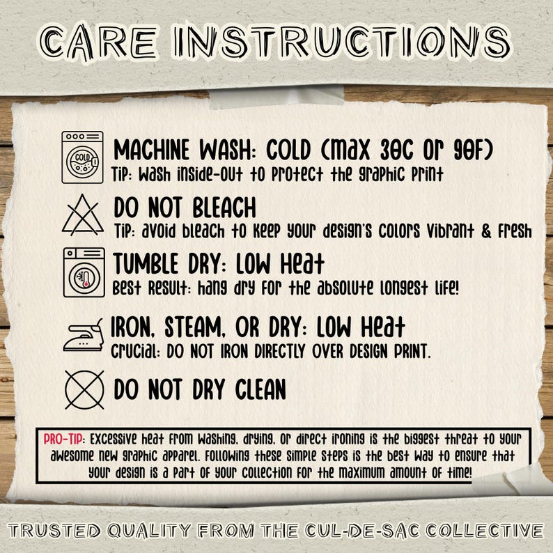 May include: A white paper care instruction card with black text and icons. It lists machine wash cold, do not bleach, tumble dry low heat, iron steam or dry low heat, and do not dry clean. Includes tips for graphic print longevity and care.