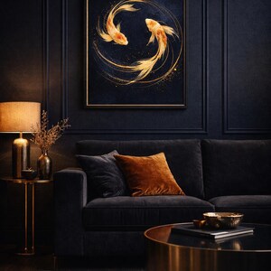 May include: A framed artwork featuring two golden koi fish swimming in a circle against a dark blue background. The artwork hangs above a dark gray sofa with orange and gray pillows. A gold side table with a lamp and a coffee table complete the room.