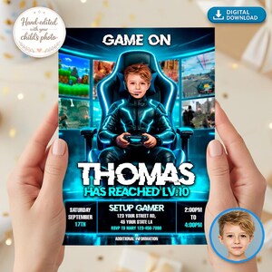 May include: A digital download invitation with a gaming theme. The invitation features a young boy in a gaming chair with the text "GAME ON" and "THOMAS HAS REACHED LV.10". Additional details include date, time, and location.