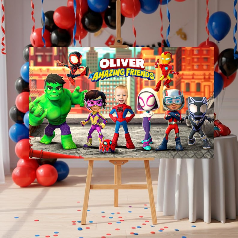 May include: A party banner with the text "OLIVER & AMAZING FRIENDS" and cartoon characters such as the Hulk, Spider-Man, and Iron Man. The banner is displayed on a wooden easel, with balloons and streamers in the background.